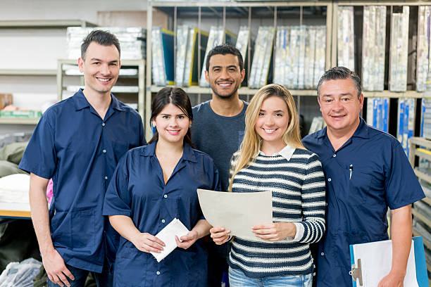 istock Group of people working at a factory 586198370