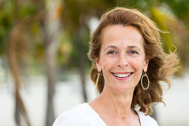 Fifty something woman Fifty something jewish lesbian woman smiling looking at the camera mediterranean woman portrait stock pictures, royalty-free photos & images
