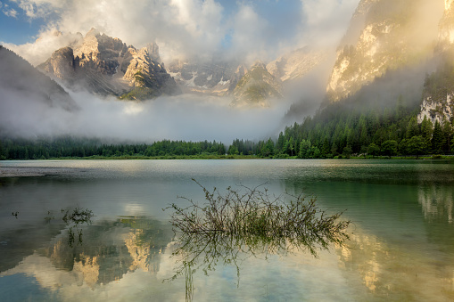 Beautiful Mountains Lake at the misty morning. Nature Landscape. Lago di Landro Durrensee, Dolomites, Alps, Italy, Europe.