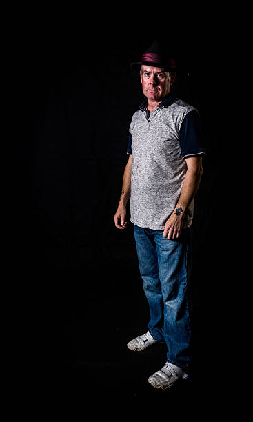 istock Mature man wearing trilby hat full length portrait 586201566