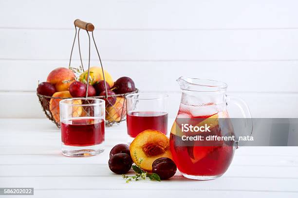 Iced Fruit Compote With Peaches And Plums Cold Summer Drink Stock Photo - Download Image Now