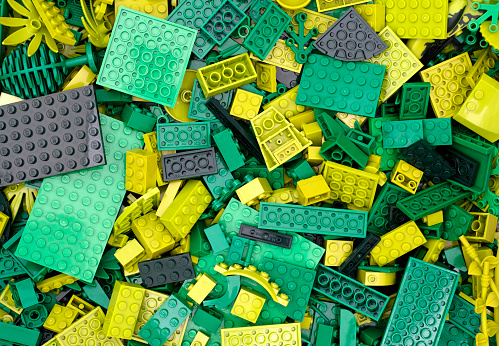 Tambov, Russian Federation - July 12, 2016 Background of green Lego blocks, bricks and pieces. Studio shot.