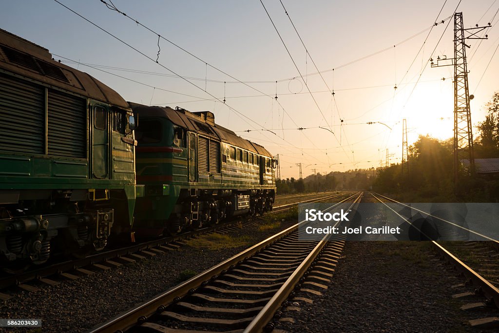Train on tracks at sunset in Mariupol, Ukraine Mariupol Stock Photo