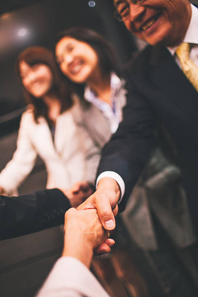 istock Japanese business deal 586203932