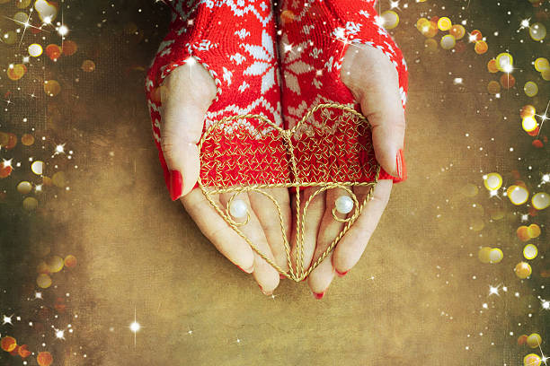 istock Christmas heart  in woman hands 586205852