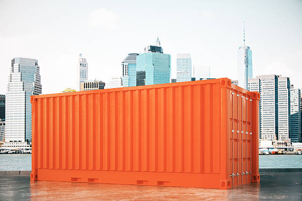 Orange cargo container on city background. 3D Rendering