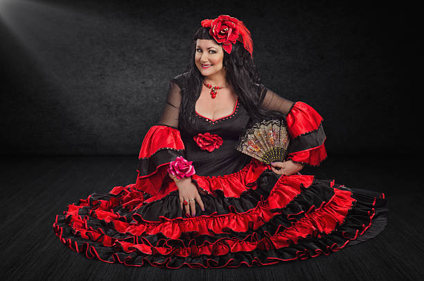 istock Smiling flamenco dancer posing on a floor 586208618