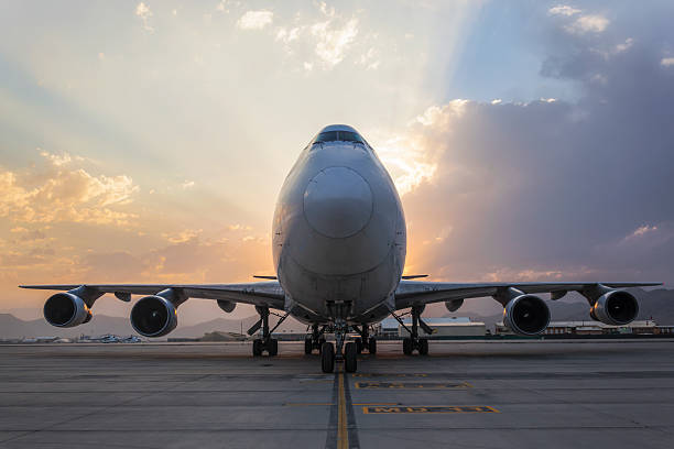istock Airplane on taxiway at sunset 586209106