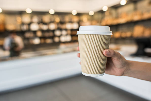 Cup of coffee to go at a cafe or pastry shop
