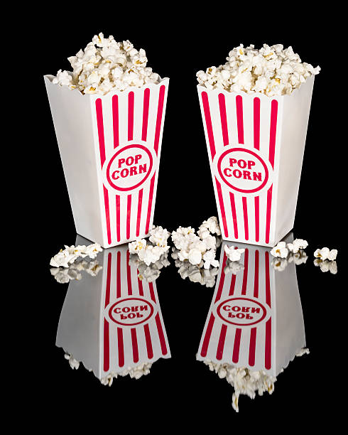 istock Movie popcorn in red and white containers 586209798