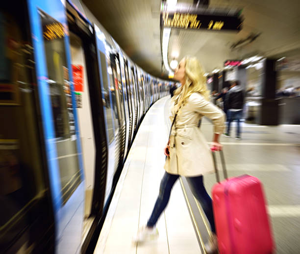 istock Blonde Swedish woman entering commuter subway train 586211436