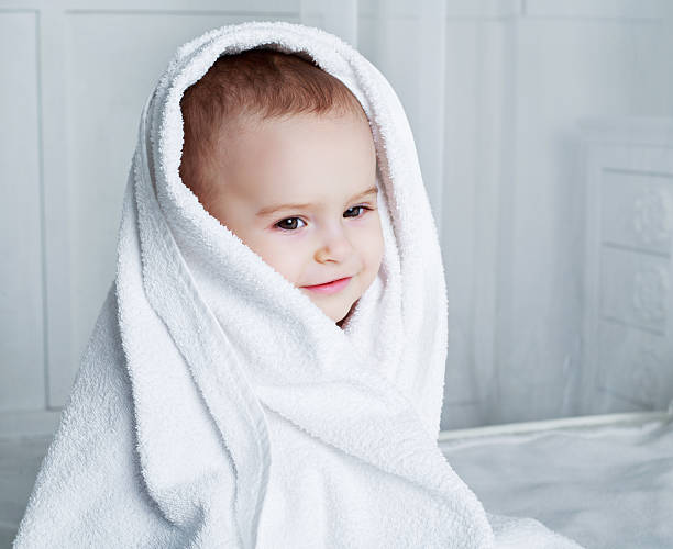 istock baby with a towel 586346452