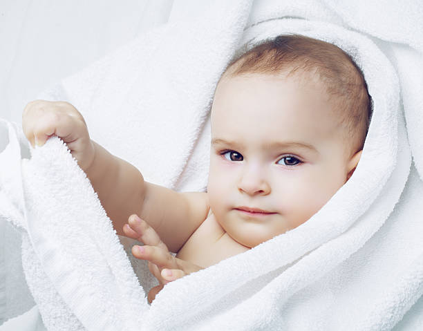 istock baby with a towel 586346934