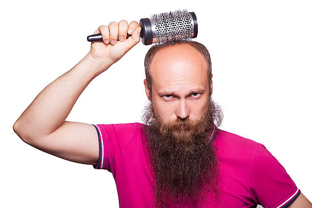 adult unhappy man hand holding comb on bald head - completely bald fotos imagens e fotografias de stock