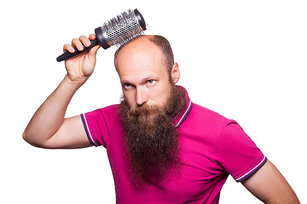 adult unhappy man hand holding comb on bald head - completely bald fotos imagens e fotografias de stock