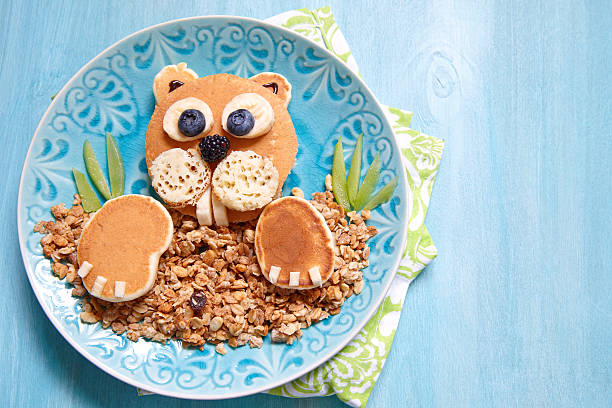 istock Funny breakfast - beaver pancake with muesli 586348600