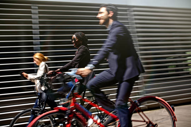 Business people riding bicycles