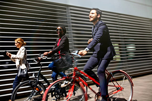 Business people riding bicycles