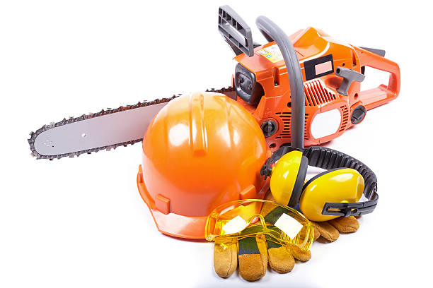 chain saw and protective clothes. - protective workwear hat violence construction imagens e fotografias de stock