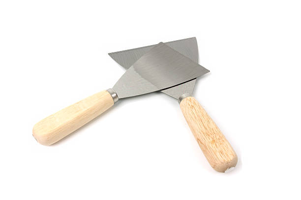 istock steel putty spattles on white background. 586351970