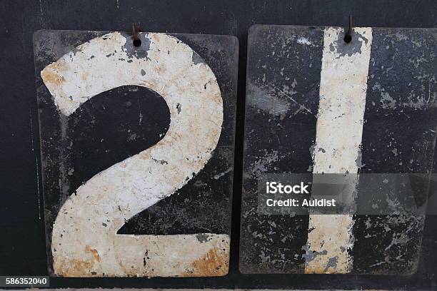 The Number Twentyone On An Old Scoreboard Stock Photo - Download Image Now - Number 21, 20-24 Years, Scoreboard