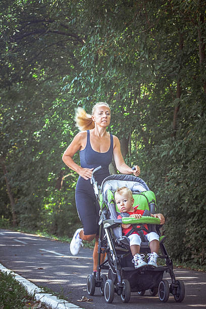 istock Jogger mom with baby in stroller 586352586