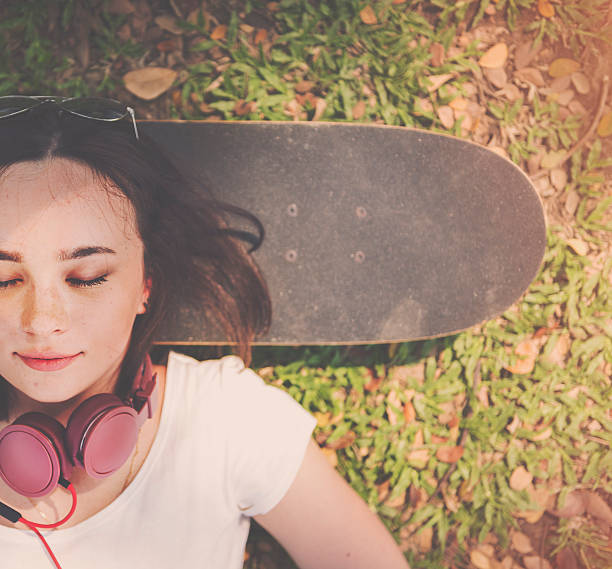 istock Skateboard Relaxation Rest Lying Chill Headphone Concept 586352894
