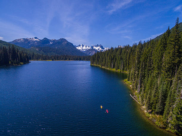 Kayakers on the lake stock photo
