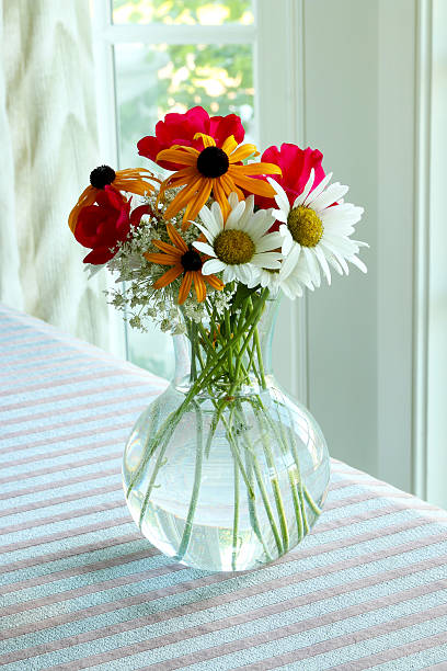 Cut Garden Flowers in a Glass Vase stock photo