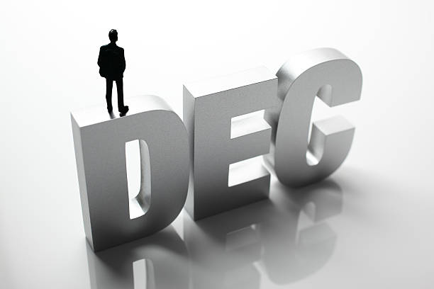 istock Figurine Businessman Standing on Big Letters DEC 586355776