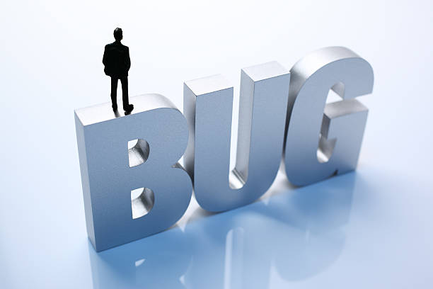 istock Figurine Businessman Standing on Big Letters BUG 586356174