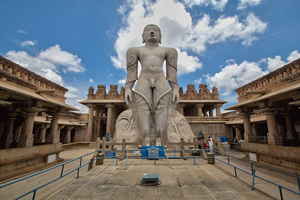 The statue of Gomateswara Bahubali Lord Gomateshwara was the Jain prince Bahubali,the younges son of  Jain emperor and the first Jain tirthankara,Vrishaba Deva(adinath). The 58-feet tall monolithic statue of Gommateshvara is located on Vindyagiri Hill. It is considered to be the world's largest monolithic stone statue. The base of the statue has an inscriptions in Prakrutha i.e. devnagari script, dating from 981 AD. The inscription praises the king who funded the effort and his general, Chavundaraya, who erected the statue for his mother. Every twelve years, thousands of devotees congregate here to perform the Mahamastakabhisheka, a spectacular ceremony in which the statue is anointed with Water, Turmeric, Rice flour, Sugar cane juice, Sandalwood paste, saffron, and gold and silver flowers. jainism photos stock pictures, royalty-free photos & images