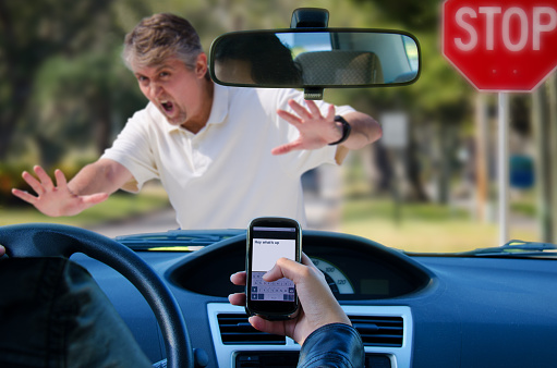 An irresponsible texting driver is about to run over a pedestrian at an intersection which shows how dangerous texting and driving is. Stop the text and stop the wrecks.