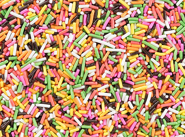 istock Colorful candy sprinkles background. Top view 586357918