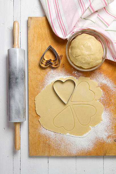istock Cookie dough, marble rolling pin and heart shape 586359796