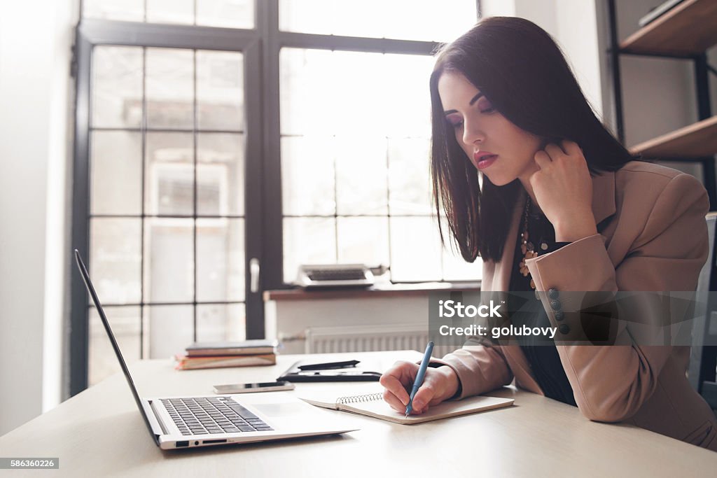 Women writing in diary. Writer concept. Women writing something in diary, sketch of new novel. Writer, journalist, screenwriter concept. Article Stock Photo