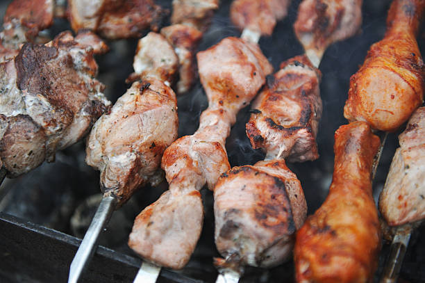 istock Closeup of grilled skewers 586364562