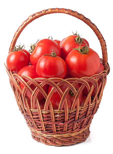 istock red tomatoes in a wicker basket isolated on white background 586367908