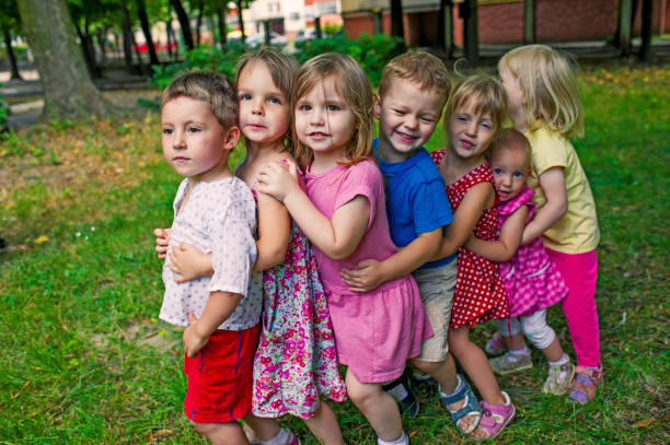 istock Cute Children Playing At Park 586368298