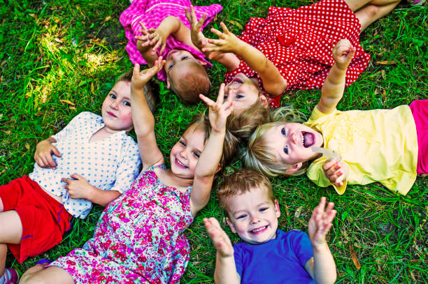 istock Cute Children Playing At Park 586368360