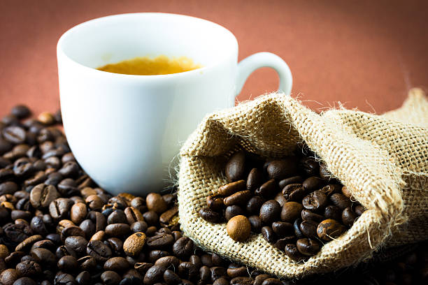 Coffee beans and cup stock photo