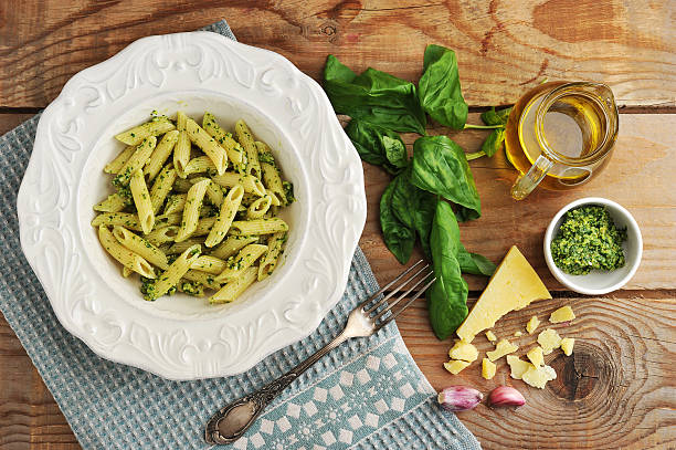 istock pasta feathers with pesto, Basil and cheese and olive oil 586371734