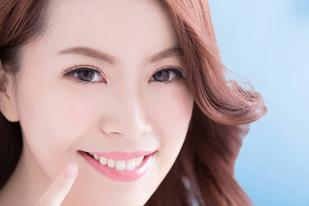 istock Beautiful woman with health teeth 586372908
