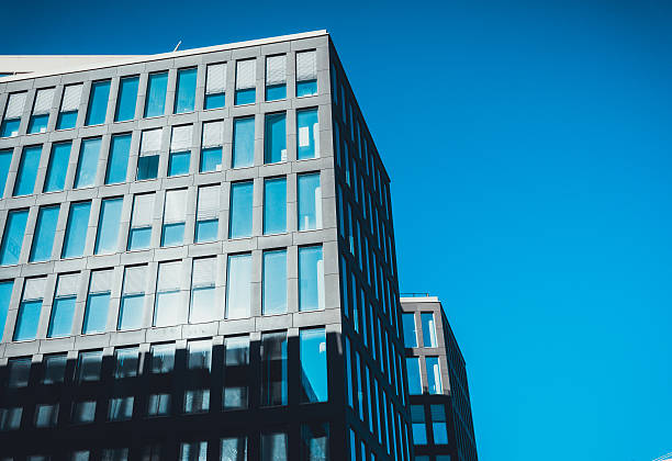 istock Tall office buildings in deep blue sky 586373092