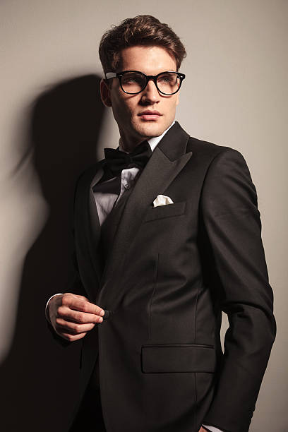 istock young elegant business man unbuttoning his jacket. 586373214