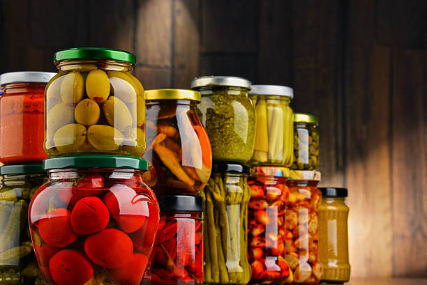 istock Jars with variety of pickled vegetables. 586373344