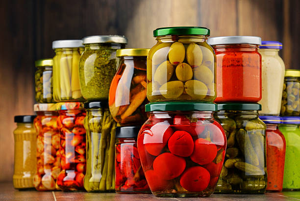 istock Jars with variety of pickled vegetables. 586373394