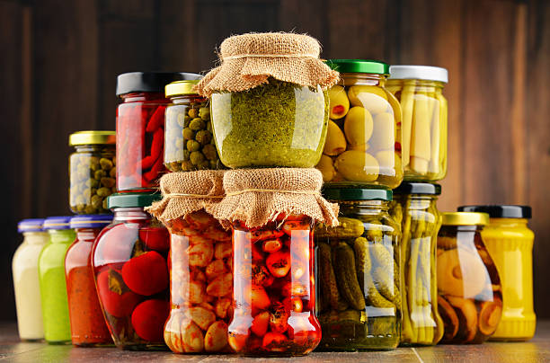 istock Jars with variety of pickled vegetables. 586373464