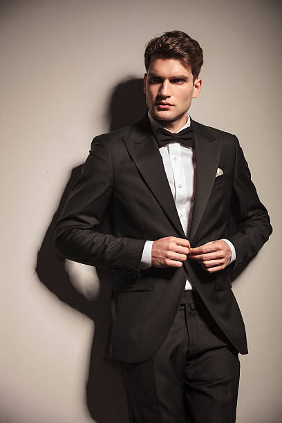 istock Young handsome business man closing his jacket 586373606