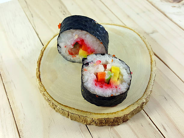 istock Sushi roll on a wood plate. 586373678